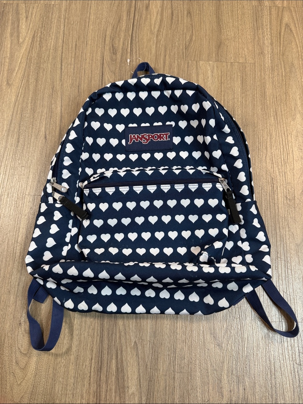 Jansport Backpack with White Heart Print, 
18” x 16” x 5”